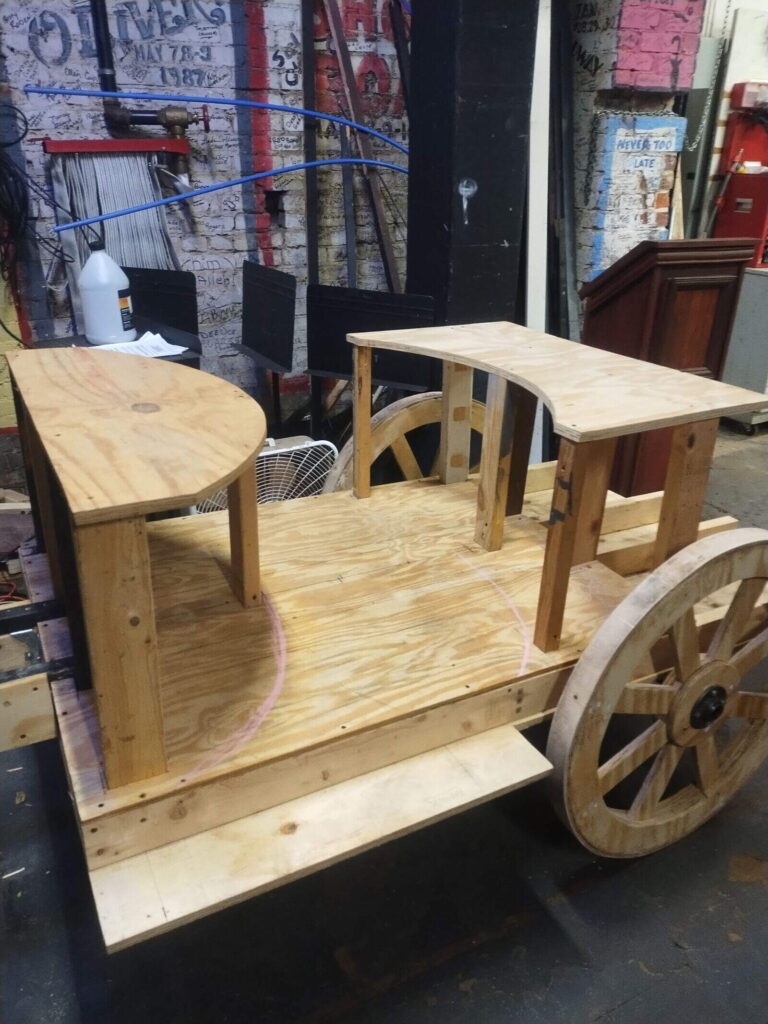Wooden carriage frame backstage with plywood and supports
