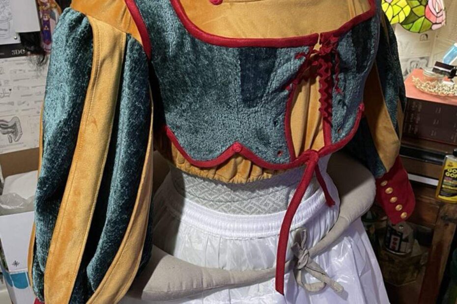 In-progress ball-room bodice in green, gold, and red with puffed sleeves