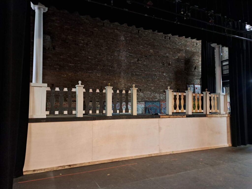 Wide shot of an unfinished raised platform with white balustrade