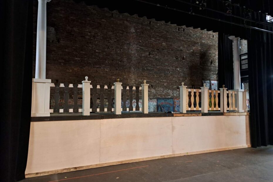 Wide shot of an unfinished raised platform with white balustrade