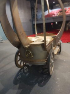 Rear angle of the carriage showing ornate medallion