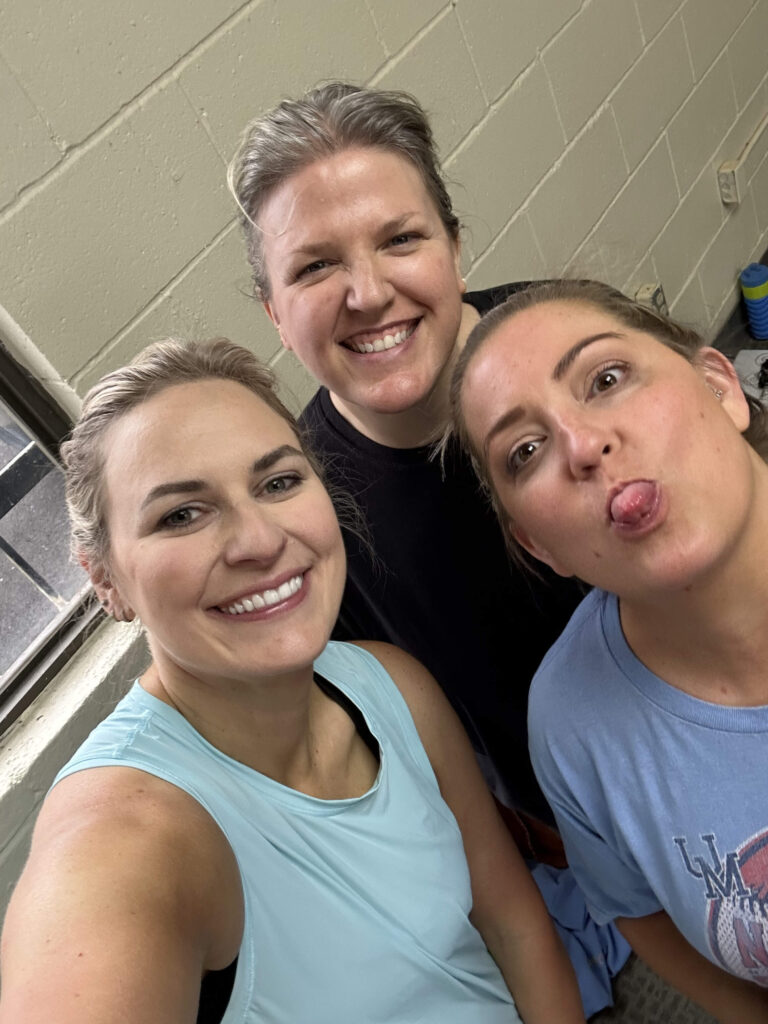 Close trio portrait - smiles, laughter and lighthearted faces after a dance run.